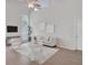 Bright living room featuring high ceilings, modern furnishings, and is naturally illuminated with large windows at 2262 Stonehedge Loop, Kissimmee, FL 34743