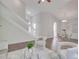 Spacious living room with staircase, neutral decor, and modern furnishings for a comfortable living space at 2262 Stonehedge Loop, Kissimmee, FL 34743