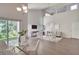 Bright living room featuring high ceilings, modern furnishings, and a sliding glass door leading to the outdoors at 2262 Stonehedge Loop, Kissimmee, FL 34743