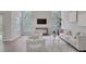 Cozy living room with comfortable seating, modern decor, and ample natural light from large windows at 2262 Stonehedge Loop, Kissimmee, FL 34743