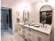 Bright bathroom with double sinks, plenty of storage, and modern fixtures at 230 E Esther St, Orlando, FL 32806