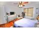 Cozy bedroom featuring a ceiling fan and natural light at 230 E Esther St, Orlando, FL 32806