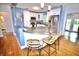 Spacious kitchen with white cabinetry, stainless steel appliances, and a granite countertop island at 230 E Esther St, Orlando, FL 32806