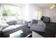 Inviting living room featuring modern furnishings and an abundance of natural light at 230 E Esther St, Orlando, FL 32806