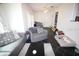 Cozy living room with a comfortable couch, chair, and ample natural light at 230 E Esther St, Orlando, FL 32806