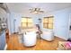 Cozy living room features hardwood floors, a comfortable sofa, stylish armchairs, and ample natural light at 230 E Esther St, Orlando, FL 32806