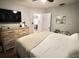 Main bedroom with hardwood floors, a ceiling fan, and lots of closet space at 230 E Esther St, Orlando, FL 32806