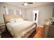 Comfortable main bedroom with hardwood floors, a ceiling fan, and plenty of closet space at 230 E Esther St, Orlando, FL 32806