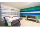 Finished garage featuring a game room and additional entertainment space at 2613 Calistoga Ave, Kissimmee, FL 34741