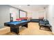 Spacious game room featuring a pool table, projector screen, and comfortable seating for leisure and entertainment at 2613 Calistoga Ave, Kissimmee, FL 34741