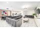 Open-concept living area featuring a dining space and kitchen; perfect for entertaining at 2613 Calistoga Ave, Kissimmee, FL 34741