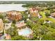 Aerial view of condo building showing amenities, pool, and a scenic lake nearby at 7500 Toscana Blvd # 331, Orlando, FL 32819