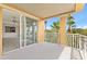 A beautiful balcony providing views of tropical palm trees and lush greenery at 7500 Toscana Blvd # 331, Orlando, FL 32819