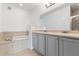 Bathroom features a double vanity, soaking tub, and tiled surround, offering a luxurious retreat at 7500 Toscana Blvd # 331, Orlando, FL 32819