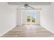 Spacious bedroom with sleek floors and large windows at 7500 Toscana Blvd # 331, Orlando, FL 32819