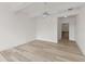 Expansive bedroom with ceiling fan and view into bathroom at 7500 Toscana Blvd # 331, Orlando, FL 32819