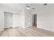 Bright bedroom with hardwood flooring, closet, and natural light perfect for relaxation at 7500 Toscana Blvd # 331, Orlando, FL 32819