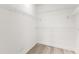 A closet featuring white walls, white trim, and shelving along the walls at 7500 Toscana Blvd # 331, Orlando, FL 32819