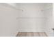 A closet featuring white walls, white trim, and shelving along the walls at 7500 Toscana Blvd # 331, Orlando, FL 32819