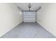 An empty garage with concrete block walls awaits a vehicle, some storage, and your personal touch at 7500 Toscana Blvd # 331, Orlando, FL 32819