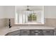Kitchen sink with an opening to a living room and beautiful outside views at 7500 Toscana Blvd # 331, Orlando, FL 32819