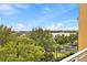 Breathtaking view of the lake from the balcony overlooking lush trees and greenery at 7500 Toscana Blvd # 331, Orlando, FL 32819