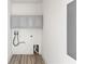 Clean laundry room with grey storage cabinets and hook-ups for a washer and dryer at 7500 Toscana Blvd # 331, Orlando, FL 32819