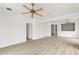 Spacious living room featuring a ceiling fan, and a picturesque view at 7500 Toscana Blvd # 331, Orlando, FL 32819