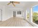 Spacious living room featuring two ceiling fans, and a picturesque view at 7500 Toscana Blvd # 331, Orlando, FL 32819