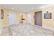 Hallway featuring clean tile floors, elevator access, and well-maintained entrances to individual units at 7500 Toscana Blvd # 331, Orlando, FL 32819