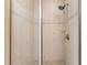 Modern shower with glass doors, decorative tile accents, and a rainfall shower head at 7500 Toscana Blvd # 331, Orlando, FL 32819
