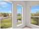 Bright room with three large windows showcasing the beautiful outdoor landscape and natural light at 7500 Toscana Blvd # 331, Orlando, FL 32819
