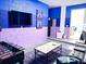 Entertainment room featuring a foosball table, large TV, and comfortable seating for fun gatherings at 7858 Spectrum Dr, Reunion, FL 34747