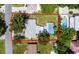 Aerial view highlighting the property's layout with a pool and tree coverage within property lines at 904 15Th Ne St, Winter Haven, FL 33881