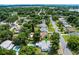 Aerial view pinpointing location, with pool, lush surroundings, and tree coverage at 904 15Th Ne St, Winter Haven, FL 33881