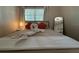 Well-lit bedroom featuring a plush bed, stylish pillows, and a serene ambiance at 904 15Th Ne St, Winter Haven, FL 33881