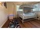 Cozy bedroom featuring a bunk bed, fun rug, and ample natural light at 904 15Th Ne St, Winter Haven, FL 33881
