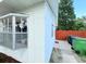 Side exterior view of the home highlighting the windows and clean white siding at 904 15Th Ne St, Winter Haven, FL 33881