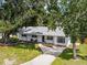 Charming single-story home with a well-manicured lawn, mature trees, and a welcoming front entrance at 904 15Th Ne St, Winter Haven, FL 33881