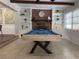 Entertainment room featuring a pool table, built-in shelving, and a cozy atmosphere at 904 15Th Ne St, Winter Haven, FL 33881