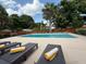 Poolside lounge chairs are presented in a serene outdoor space at 904 15Th Ne St, Winter Haven, FL 33881