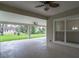 Large back patio with ceiling fans, recessed lights, and an adjacent lawn at 18813 Mosby St, Orlando, FL 32833