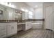 Elegant bathroom showcasing dual vanities and a soaking tub at 18813 Mosby St, Orlando, FL 32833