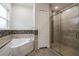 Inviting bathroom featuring a walk-in shower and soaking tub at 18813 Mosby St, Orlando, FL 32833
