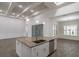 Large open kitchen with a center island, recessed lighting, granite countertops, and wood floors at 18813 Mosby St, Orlando, FL 32833