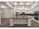 Spacious kitchen featuring a large island, stainless steel appliances, and modern finishes at 18813 Mosby St, Orlando, FL 32833