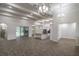 Large open concept living room with wood floors, recessed lighting, archways, and an adjoined kitchen at 18813 Mosby St, Orlando, FL 32833