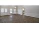 Spacious living room featuring wood floors, decorative trim, and plenty of natural light at 18813 Mosby St, Orlando, FL 32833