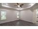 Spacious primary bedroom with tray ceiling and ample natural light at 18813 Mosby St, Orlando, FL 32833