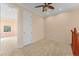 Cozy carpeted bedroom with attached bathroom and neutral paint, providing a tranquil retreat at 1011 Wood Cv, Kissimmee, FL 34743